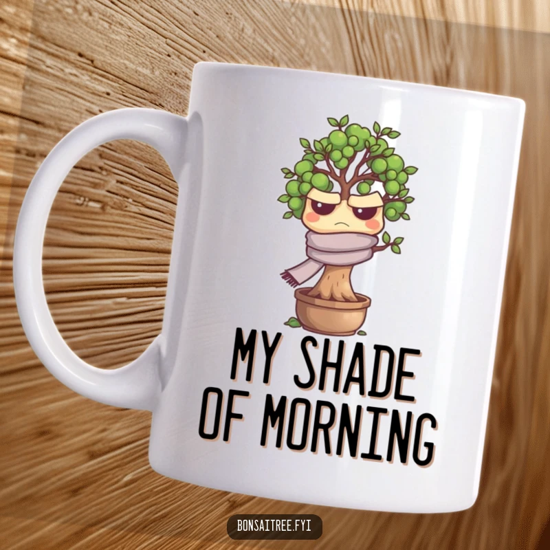 Funny grumpy bonsai tree character wearing a scarf, looking annoyed on a ceramic mug, perfect for coffee lovers.