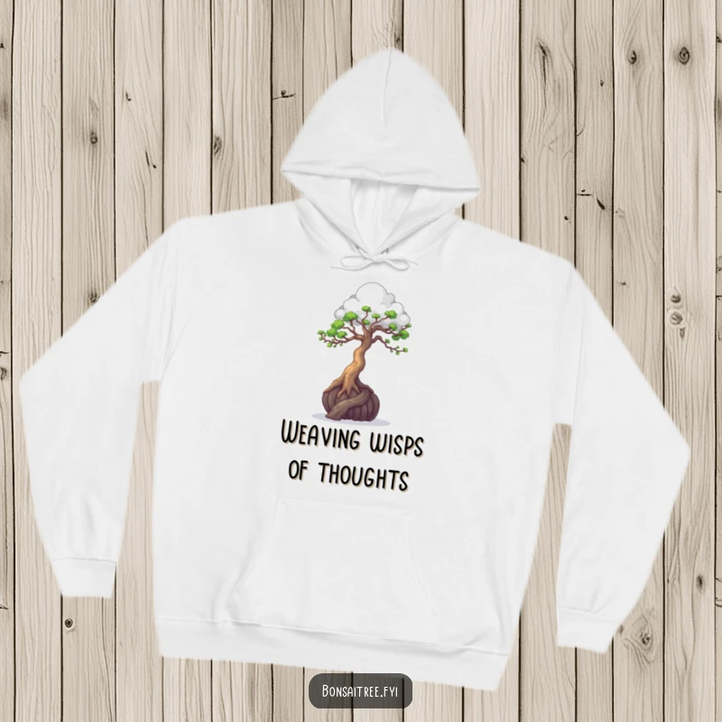 Funny, warm hoodie of a bonsai tree artistically sculpting a cloud with its branches, perfect for creators.
