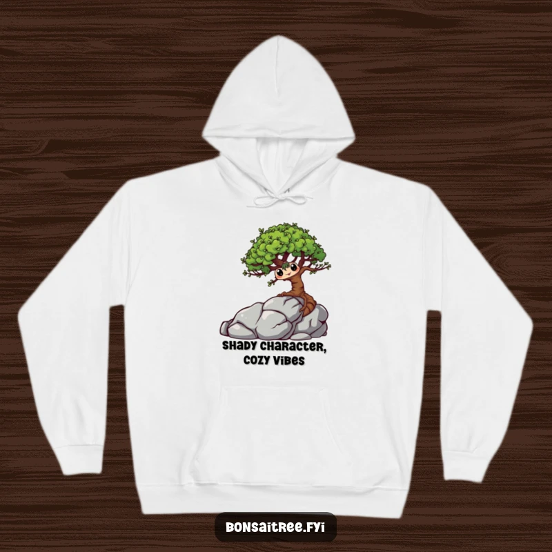 Funny Bonsai Tree Hoodie showcasing a mischievous character playfully hiding behind a rock, offering warmth and quirky charm.
