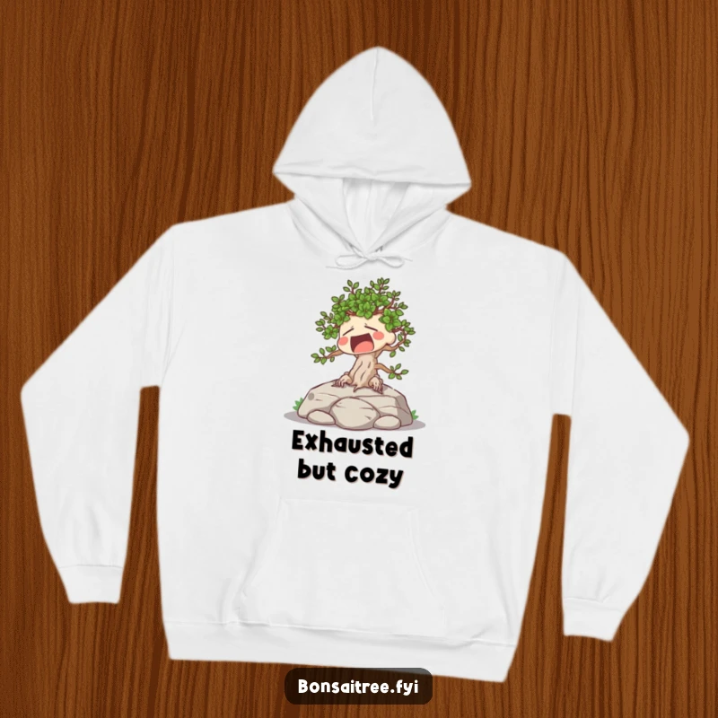Funny hoodie depicting a yawning, sunbathing bonsai tree character, perfect for expressing a desire for rest.