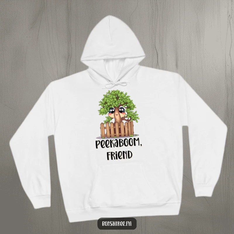 Funny pullover hoodie with a wide-eyed bonsai tree character peeking curiously over a miniature fence, offering warmth and humor.