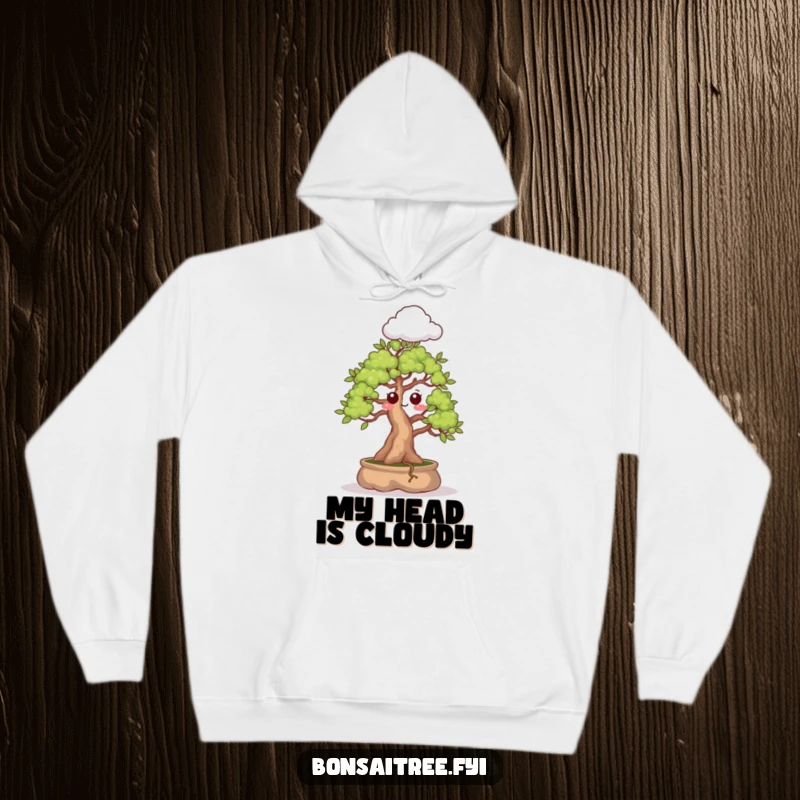 Funny hoodie illustration of a bonsai tree with a surprised expression, sprouting a small cloud, creating a cozy and whimsical look.