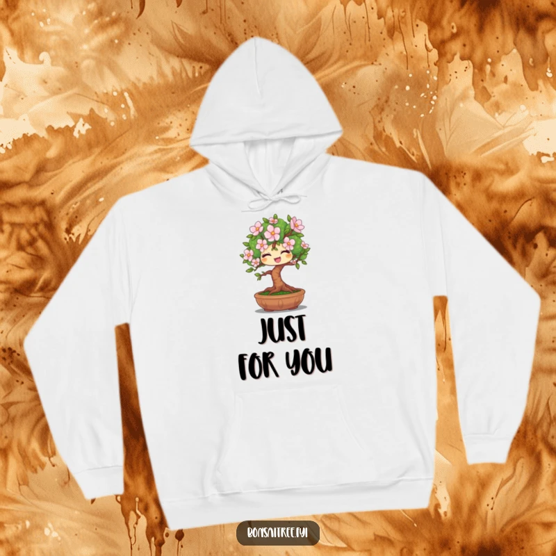 Funny hoodie depicting a winking bonsai tree character holding out a single flower, creating a warm and humorous visual.