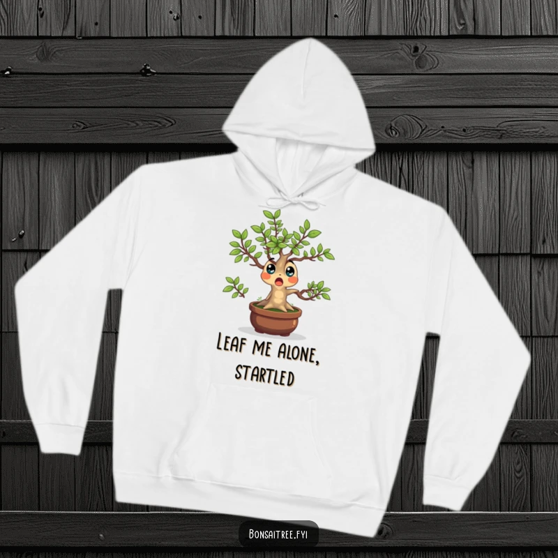 Funny Bonsai Tree Hoodie showcasing a surprised character with leaves popping outwards, offering warmth and quirky charm.