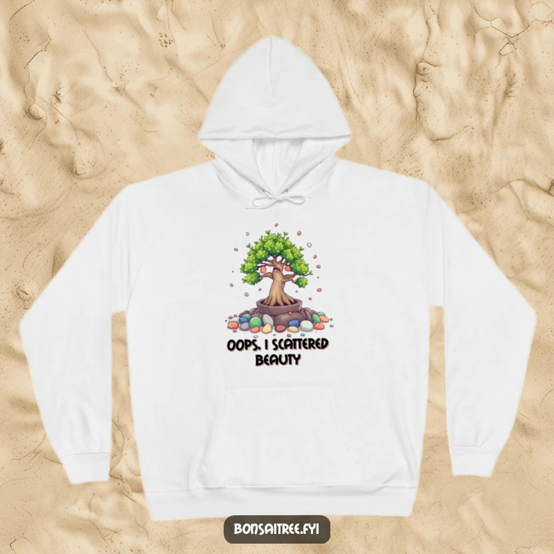 Funny hoodie depicting a giggling bonsai tree character playfully spilling tiny painted stones. Comfortable and humorous.