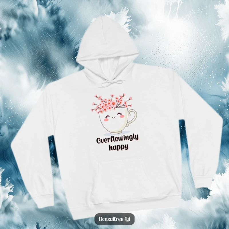 Funny hoodie displaying a smiling teacup character generously overflowing with delicate pink cherry blossoms, creating a visually cheerful scene.