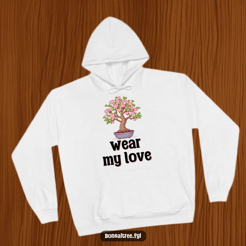 Funny hoodie featuring a miniature bonsai tree whose leaves are shaped like small hearts. Offers warmth and a sweet, humorous design.