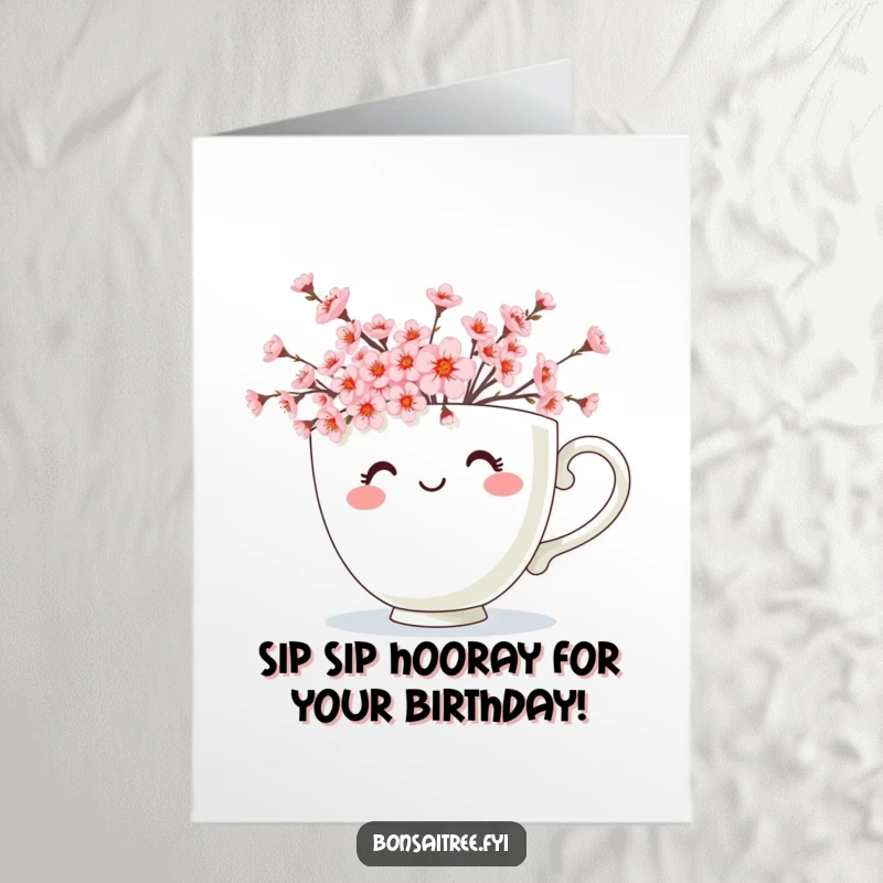 Free Printable Birthday Card: Cheerful teacup overflowing with delicate pink cherry blossoms, radiating happiness, perfect for gifting.