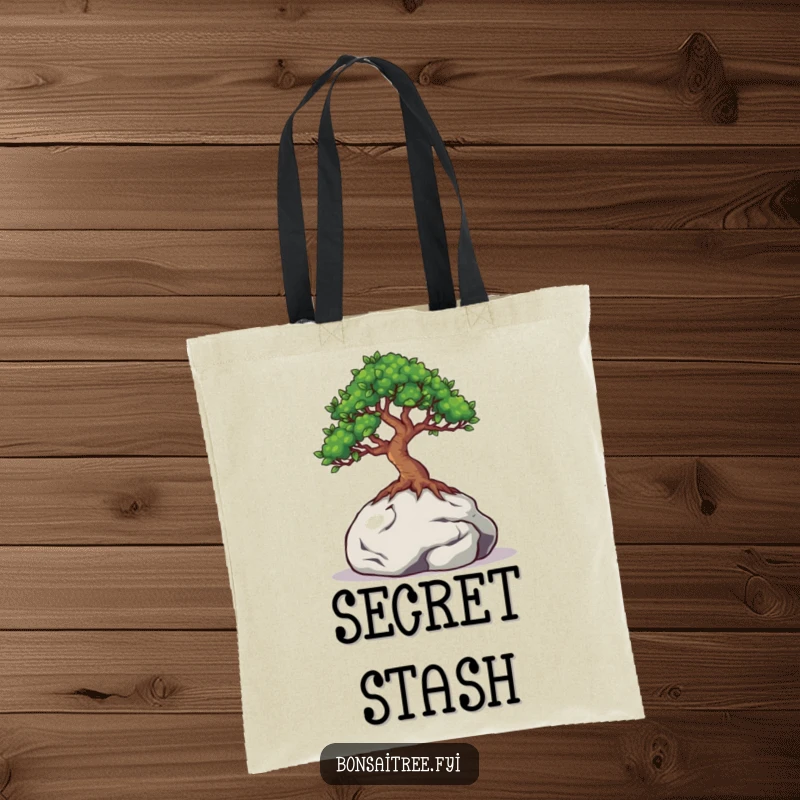 Funny tote bag featuring a bonsai tree with eyes peeking from behind a miniature rock, ideal for carrying items with a hint of mystery.